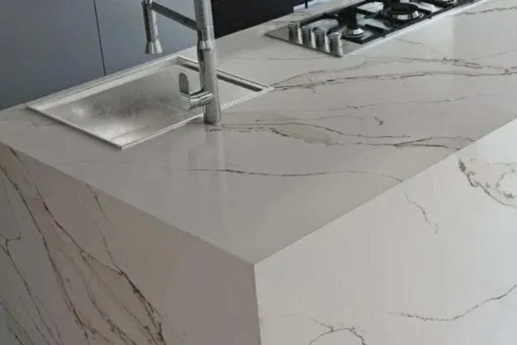 closeup shot of the corner of the marble kitchen island