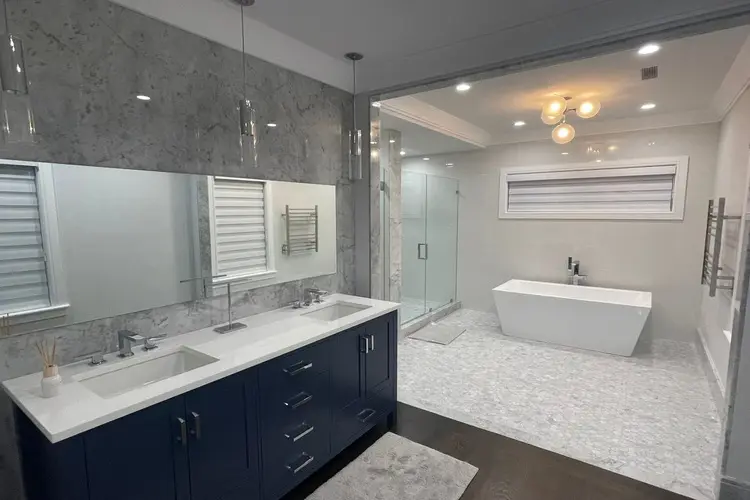 a stylish bathroom with a white bathtub