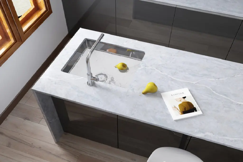 Pental quartz Kitchen island with a tap and a sink