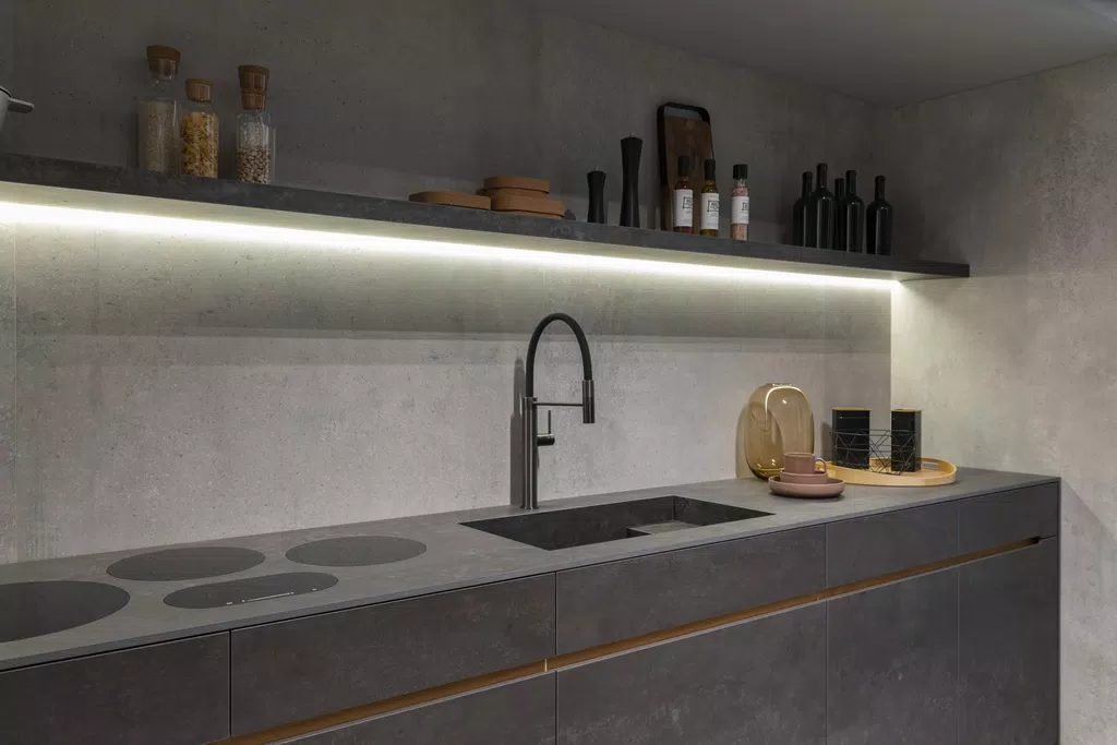 a kitchen countertop with a sink and a tap